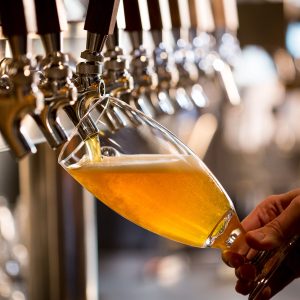 Craft beer pour being tapped